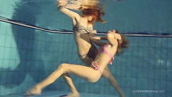 Blonde And Brunette Lesbians Explore Their Desires In The Water